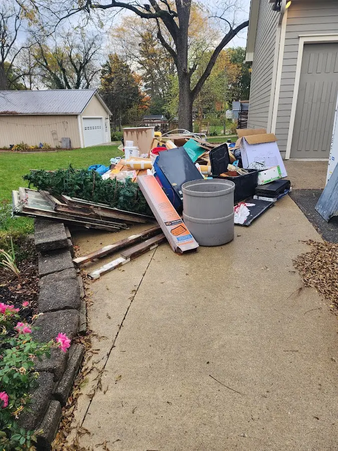 Dumpster being loaded with debris for 3 Yard Dumpster Rental in West Salem